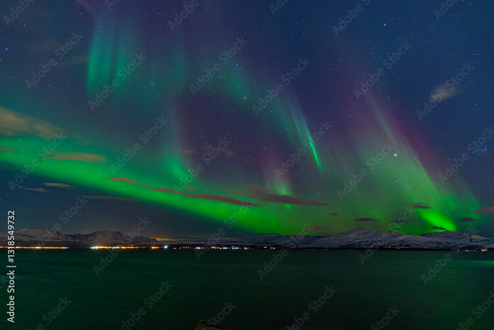 Naklejka premium Telegrafbukta, Tromsø, Norway - 27 February 2025 - Norwegian sky filled with solar particles that cause the Northern Lights to appear