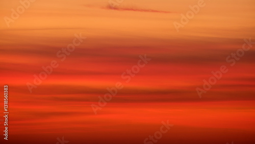 Fototapeta Naklejka Na Ścianę i Meble -  Blurred sunset sky with orange and red gradient clouds. Nature background for design and print