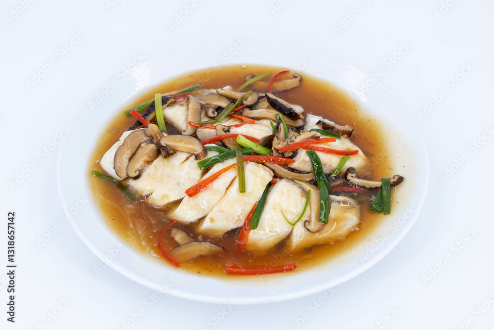 Sea bass fillet steam with soy sauce, Steamed fish in soy sauce broth, garnished with fresh mushrooms, julienned ginger, red chilies, and spring onions, Thaifood Sea bass fillet steam with soy sauce, Steamed fish in soy sauce broth, garnished with fresh mushrooms, julienned ginger, red chilies, and spring onions, Thaifood