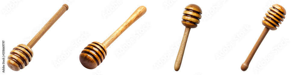 Obraz premium Wooden honey dippers isolated on transparency background, showcasing different angles