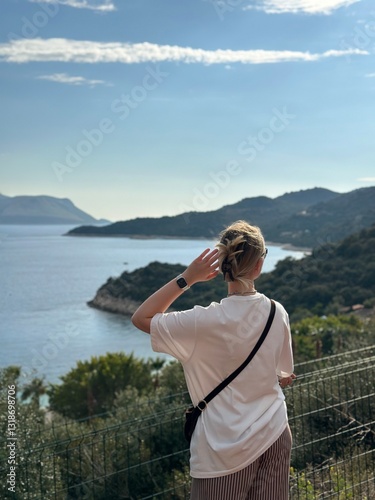 Coastal travel portrait of a woman by the sea, digital nomad and retreat vibe, blue water and island bay, summer vacation lifestyle, wellness slow travel and mindful escape, scenic background with cop