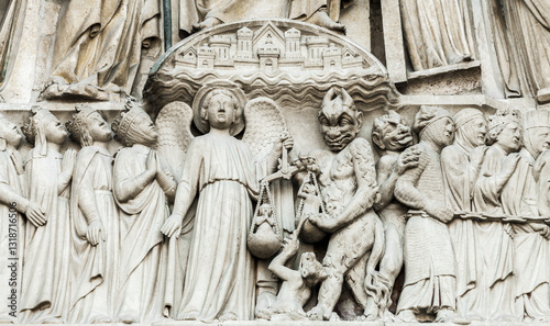 Sculpture of the Day of Judgement adorning Notre Dame Cathedral in Paris, France