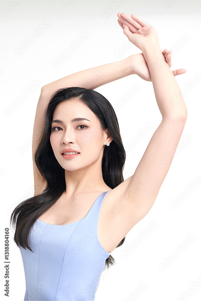 Beautiful Young Asian woman Raises her hands to Showcase clean and hygienic underarms Against a white background, Smooth armpit cleanliness and protection concept Beautiful Young Asian woman Raises her hands to Showcase clean and hygienic underarms Against a white background, Smooth armpit cleanliness and protection concept