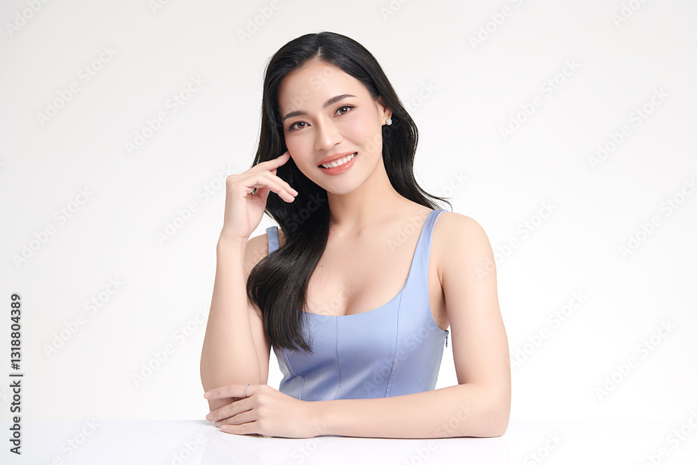 A beautiful young Asian woman with clean, fresh skin against a white background. She represents beauty, skincare, and spa treatments. A beautiful young Asian woman with clean, fresh skin against a white background. She represents beauty, skincare, and spa treatments.