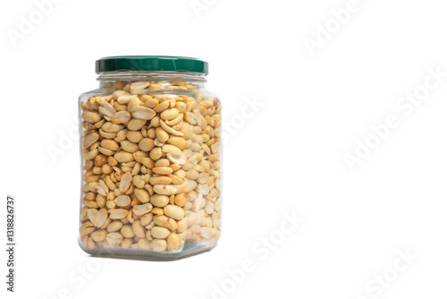 Glass jar with green lid filled with peanuts on isolated white background. Close up of snack peanut filled jar. Nutrition, storage, health and vegetarian concept. Copy space