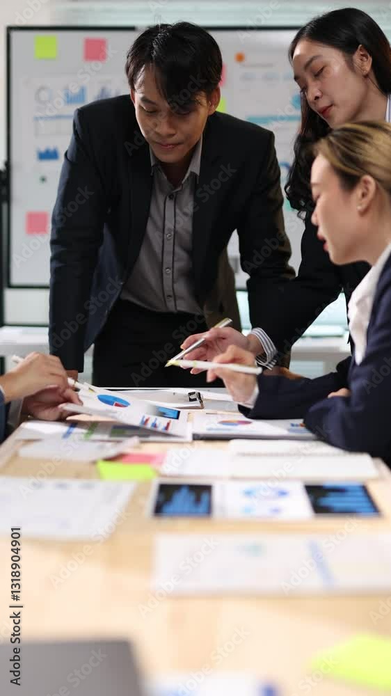 Marketing team analyzing data and brainstorming on project, reviewing data and discussing ideas for their next marketing campaign. Marketing team analyzing data and brainstorming on project, reviewing data and discussing ideas for their next marketing campaign.