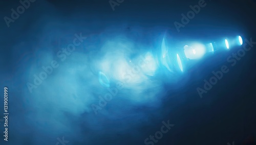 A bright blue light shining through atmospheric smoke and haze