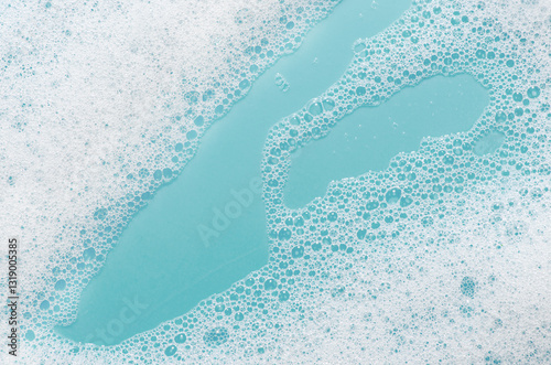 Texture of white foam. Cleansing mousse for the face or bath foam or washing powder. photo
