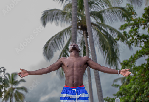 Man with Arms Outstretched in Nature