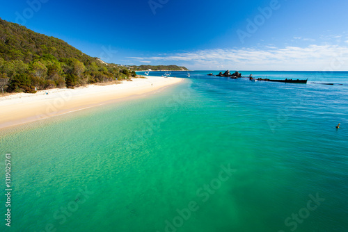The Wrecks at Moreton Island settled in the clear blue green waters of Moreton Bay.