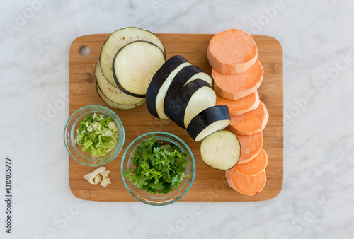 Top down of various food ingredients on chopping board photo