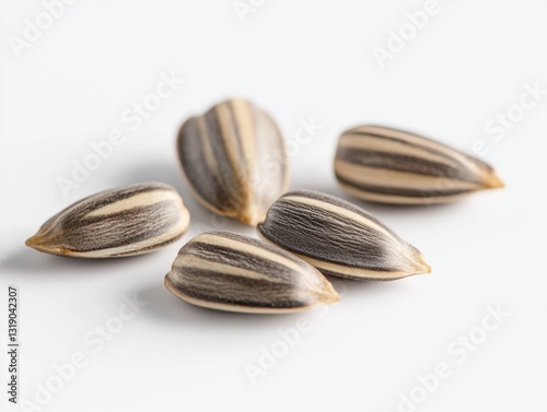 Wallpaper Mural Sunflower Seeds Close-Up: A close-up shot captures the intricate details of sunflower seeds scattered, inviting viewers to appreciate nature's simplicity and nutritional value. Torontodigital.ca