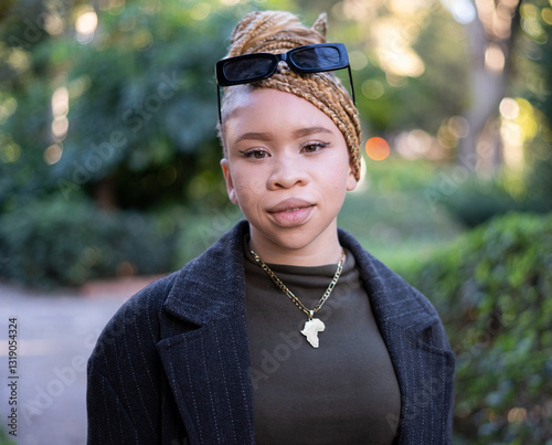 Albino african american woman posing in a park photo