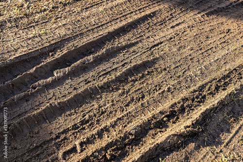 car wheel tracks on wet ground, bad road