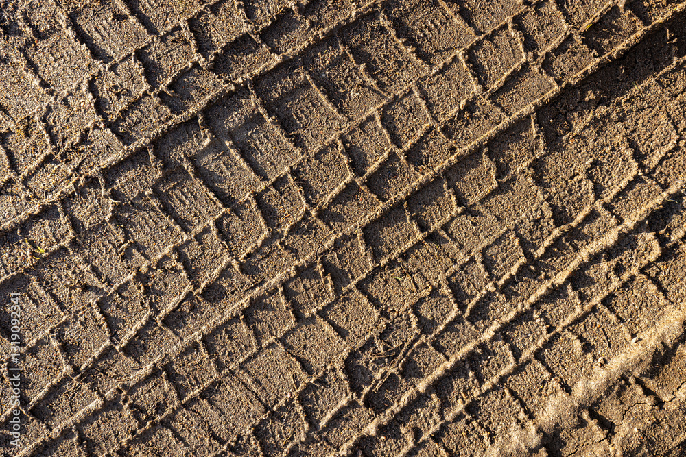 car wheel tracks on wet ground, bad road