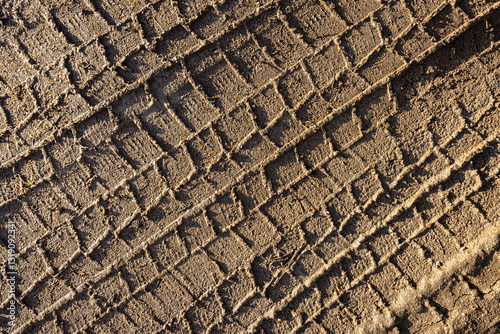 car wheel tracks on wet ground, bad road