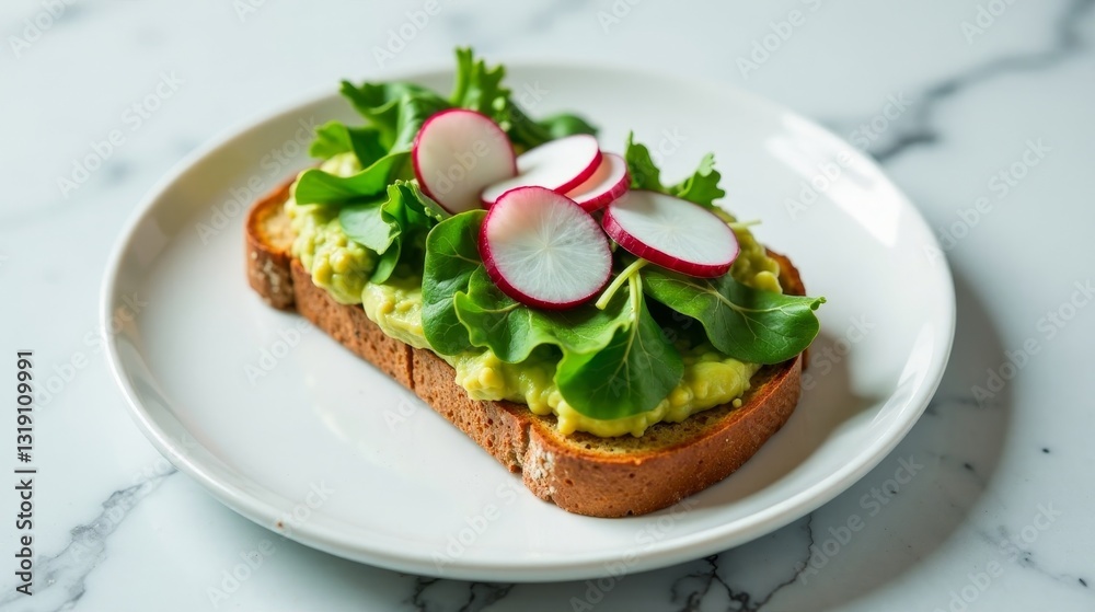A Delicious and Healthy Avocado Toast Topped with Fresh Radishes and Greens Served on a Simple White Plate A Delicious and Healthy Avocado Toast Topped with Fresh Radishes and Greens Served on a Simple White Plate