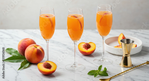 Festive Peach Bellinis: Three Delicious Summer Cocktails on a Marble Tabletop photo