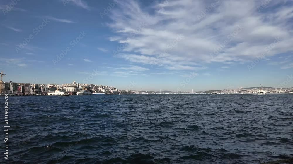 Scenic Bosphorus Ferry Ride with Seagulls Flying Over the Sea on a Sunny Day in Istanbul, Turkey – Beautiful Cityscape and Ocean Waves in the Background Scenic Bosphorus Ferry Ride with Seagulls Flying Over the Sea on a Sunny Day in Istanbul, Turkey – Beautiful Cityscape and Ocean Waves in the Background