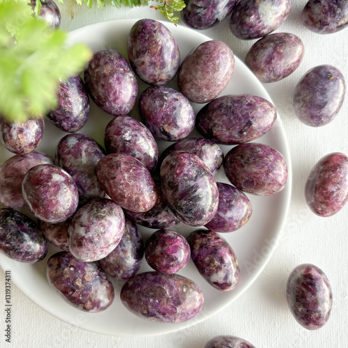 Lepidolite, with its soft purple and lavender hues, is known for stress relief, emotional balance, and tranquility. Rich in lithium, it promotes calmness and stability, making it ideal for meditation 