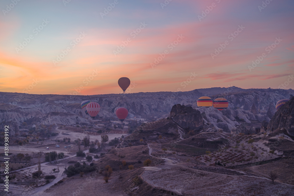 Early morning view of hot air balloons rising up in Cappadocia, Turkey