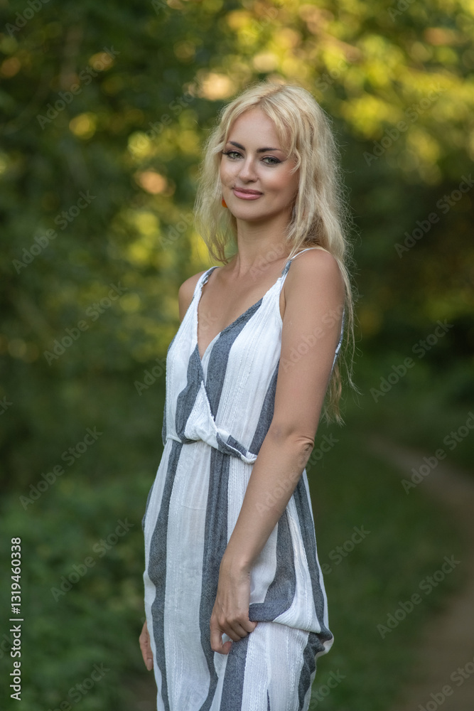 Portrait of a young beautiful blonde girl outdoors. Black and white photo. Portrait of a young beautiful blonde girl outdoors. Black and white photo.