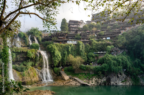 Canvas Print Beautiful waterfall and ancient village at Furongzhen or Furong ancient town in Hunan, China