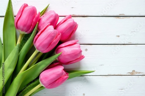 Vibrant pink tulips cluster, aged white wood planks, vibrant, springtime