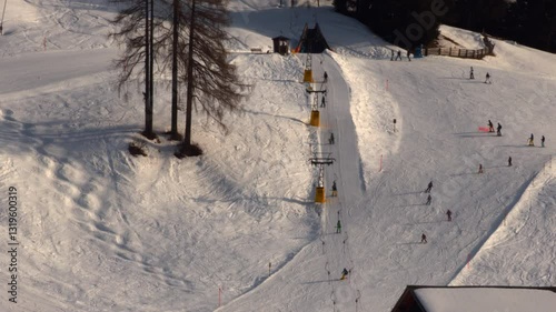 Skiors on ski slopes runs in Davos, Swiss Alps, Switzerland February 2025