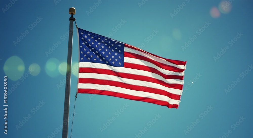 Fototapeta premium American Flag waving proudly against the vibrant blue sky, a symbol of freedom and national pride, evoking patriotism