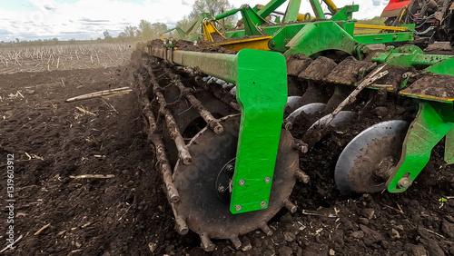 Versatile cultivator with disk, cultivate, harrow tools for secondary tillage photo