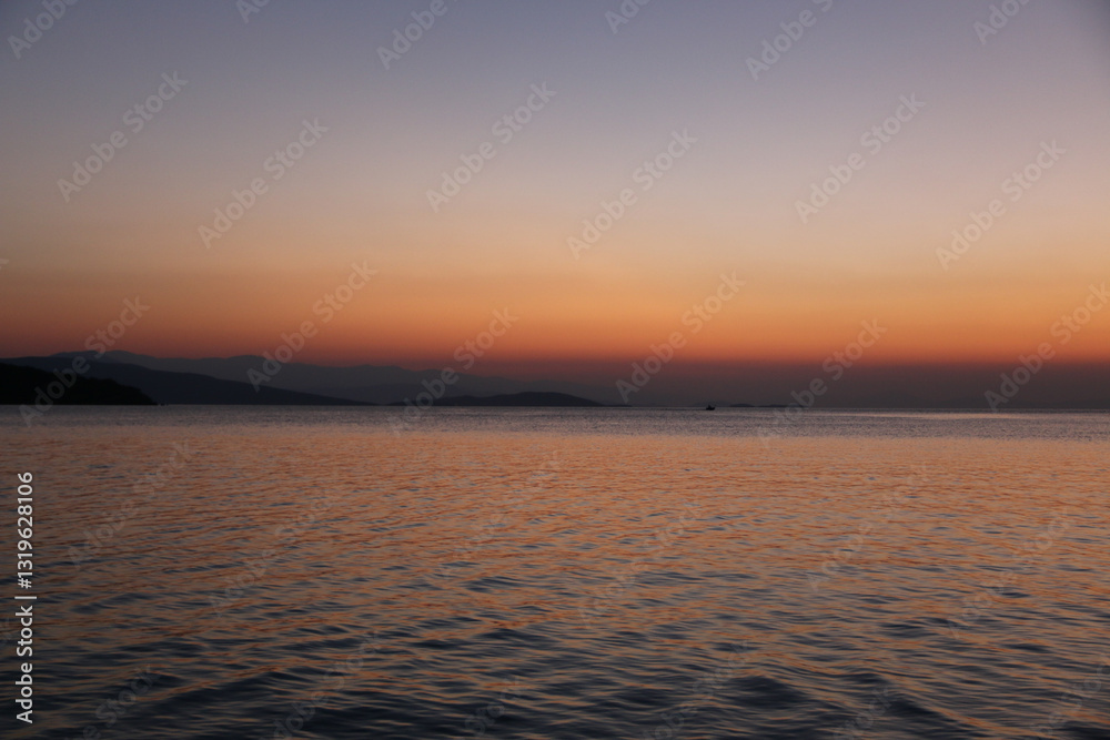 Obraz premium Sunset at the beach - Milina, Greece