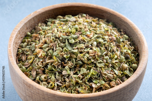 A bowl full of dried and ground natural mountain thyme,closeup