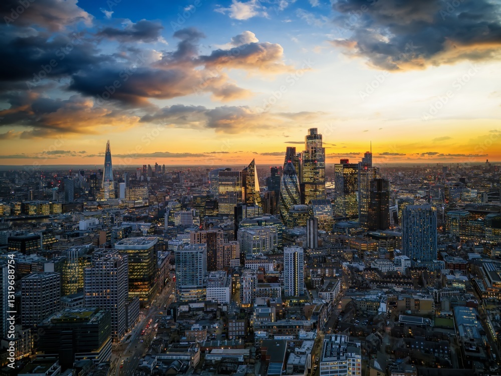 Panoramic aerial view of the illuminated skyline at the City of London, England, during dusk
