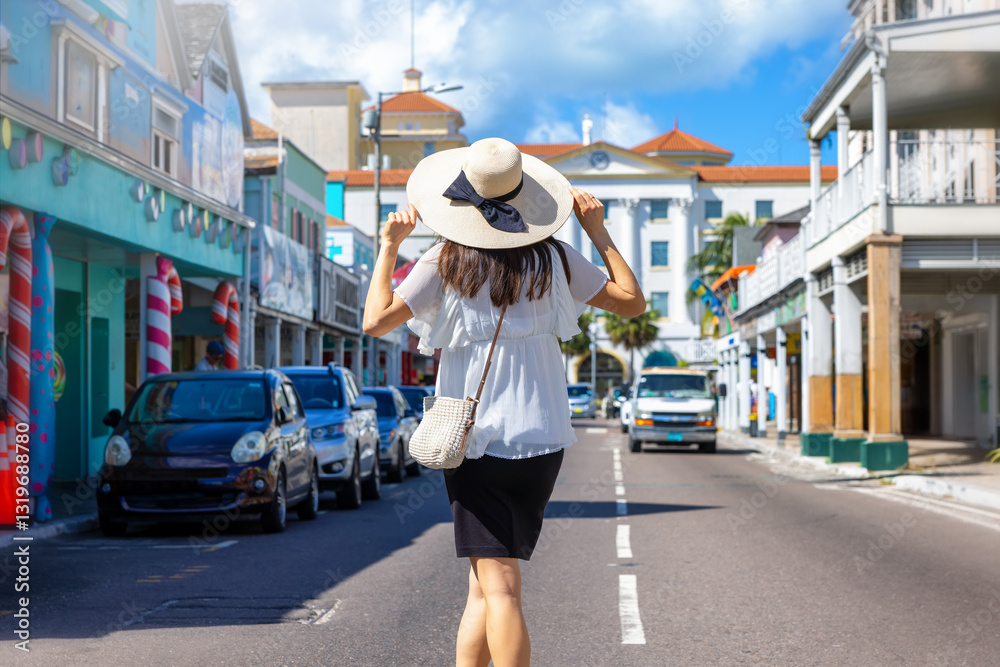 A tourist woman on a sightseeing trip through the colourful streets of Nassau, Bahamas, Caribbean