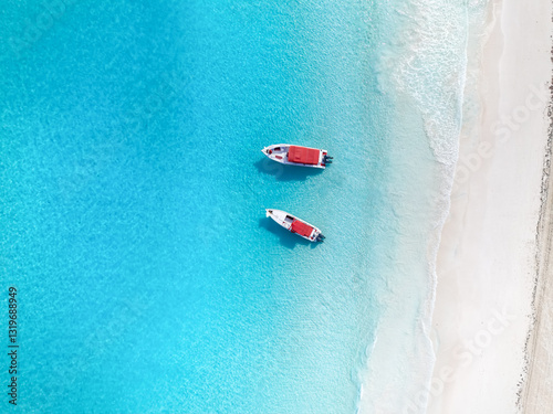 Obraz na płótnie Aerial top down view of a tropical paradise beach at the Exuma islands, Bahamas, Caribbean Sea, with two moored excursion boats w salonie