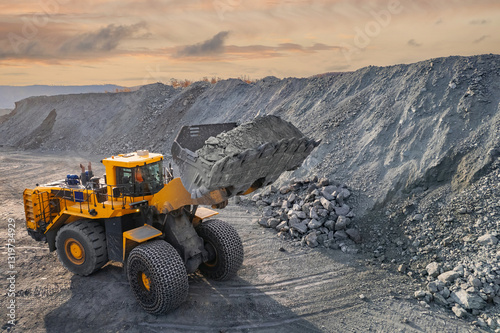 Εκτύπωση καμβά Industrial excavator loader of gold ore to truck, mining industry, Aerial top vi