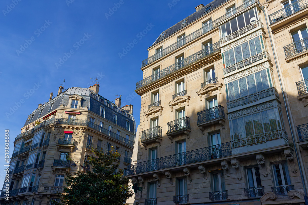 Fototapeta premium Exterior architecture of Traditional French house with typical balconies and windows in Paris. France.