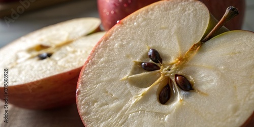 Obraz na płótnie Freshly sliced apples revealing their juicy texture and seeds on a wooden surface in natural light during the afternoon w salonie