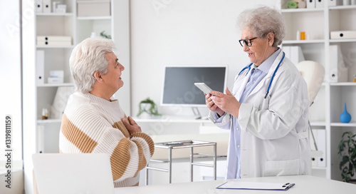 Senior doctor working with ...