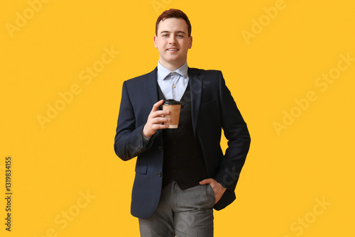 Young man holding paper cup...