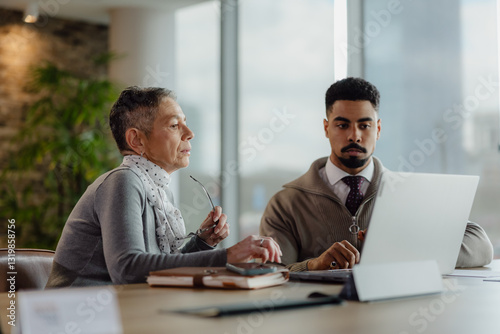 Two Professionals Collaborating in a Modern Office Environment