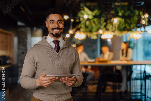 Smiling Business Professional with Tablet in Modern Collaborative Workspace