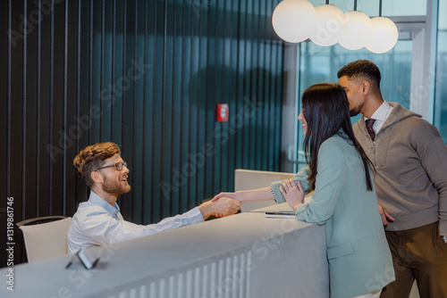 Professional Reception Interaction Between Staff and Clients at Business Office Desk