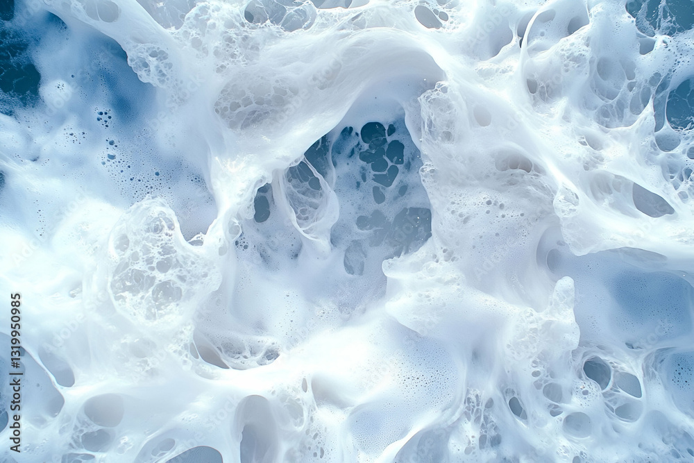 Close-Up Shot of Foamy Ocean Waves Rolling Onto the Shore in a Vibrant Blue Sea Close-Up Shot of Foamy Ocean Waves Rolling Onto the Shore in a Vibrant Blue Sea