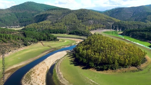 Aerial view of the Melero meander, formed by the Alagón River near the town of Riomalo de Abajo. It is a natural area of great beauty that can be seen from the Antigua viewpoint.  photo