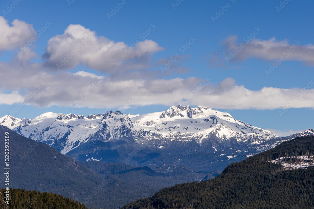 Snow-Capped Chief Mountain in Squamish, BC, Canada under a Clear Blue Sky Snow-Capped Chief Mountain in Squamish, BC, Canada under a Clear Blue Sky