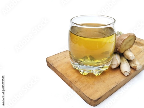 Boiled lemongrass and ginger water in a glass on a wooden chopping board, Healthy drink lifestyle  photo