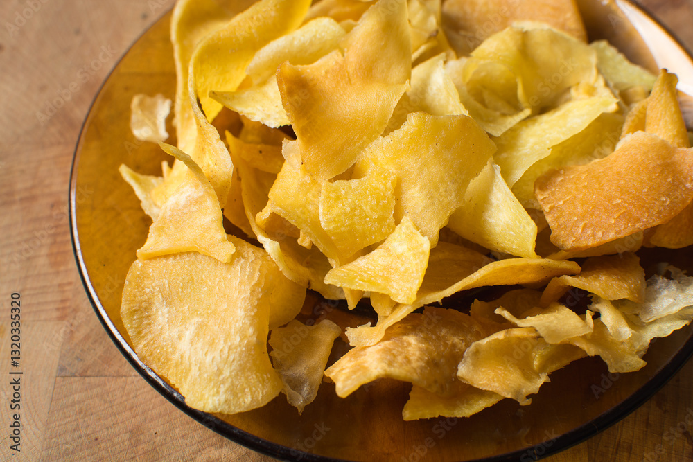 Overhead view of golden sweet potato chips, top view of crispy fried sweet potato chips Overhead view of golden sweet potato chips, top view of crispy fried sweet potato chips