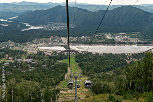 Manzherok resort, Russia. Cable car trip to viewpoints in the mountains. chairlift cab on the background of mountains and forests. photo